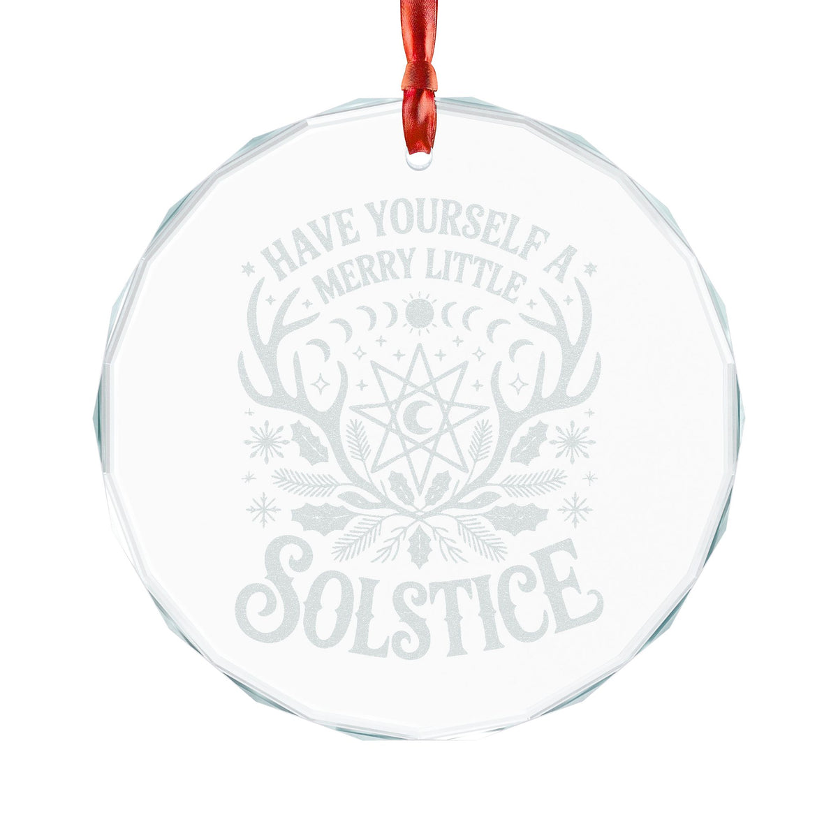 A round clear glass Christmas ornament with a red hanging ribbon, featuring a light gray frosted design with the words 'HAVE YOURSELF A MERRY LITTLE SOLSTICE' and a winter solstice motif including antlers, a moon, and holly.