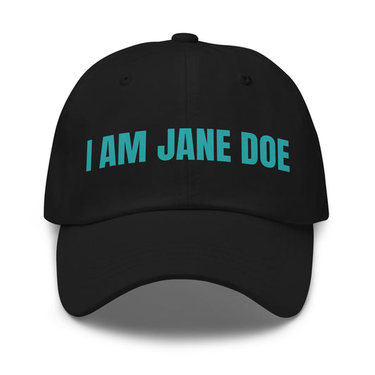 Black cap with 'I AM JANE DOE' embroidered in teal thread on a white background