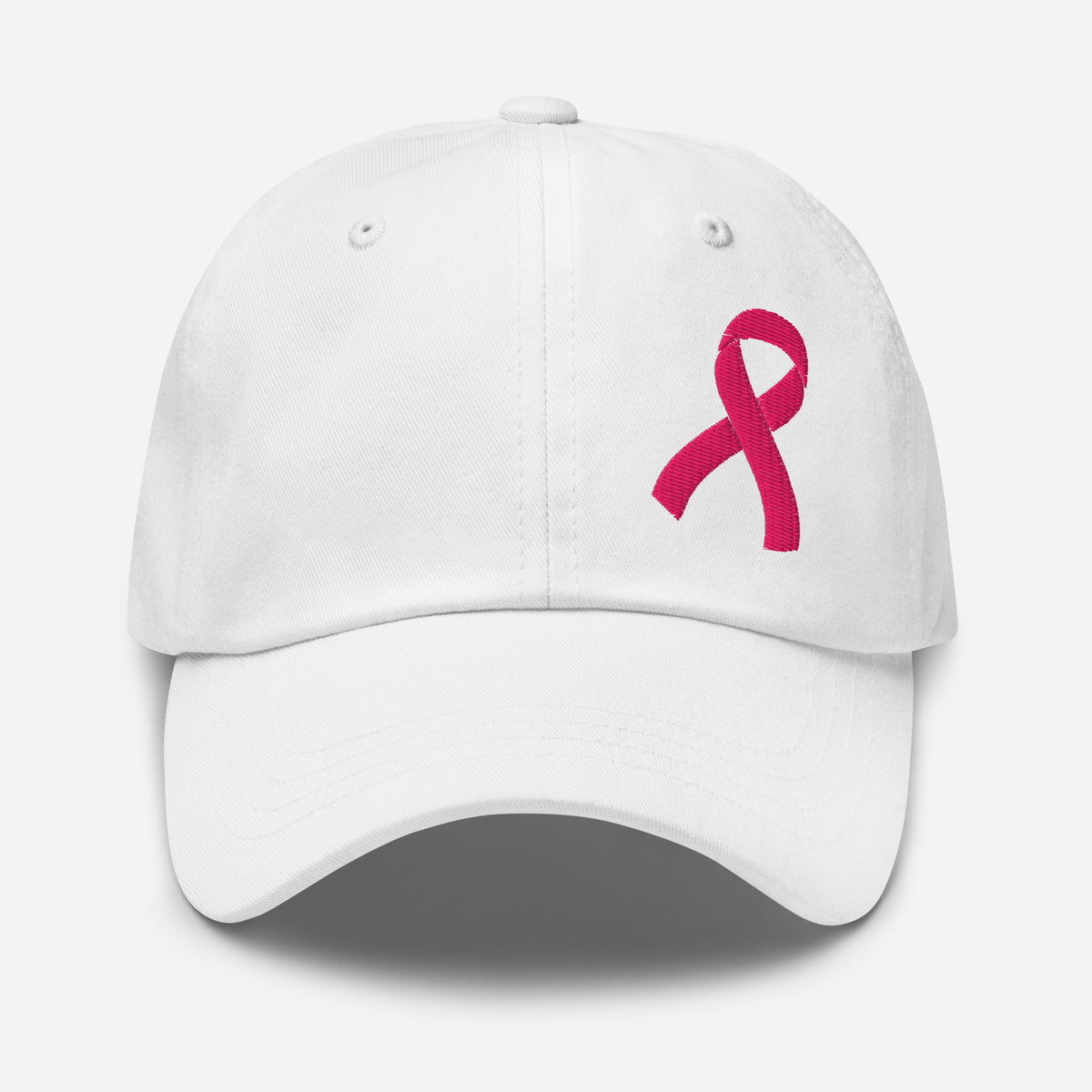 A white baseball cap featuring an embroidered pink breast cancer awareness ribbon on the front right side, set against a clean light gray background.
