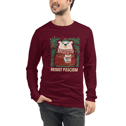 A man wearing a maroon long-sleeve t-shirt with a graphic of a polar bear wearing a red Santa hat and scarf, surrounded by green pine branches, with the text 'RESIST FASCISM' printed below. The background is solid white.